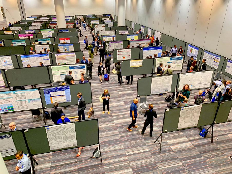 Attendees mingle at a poster session in North's exhibit hall E