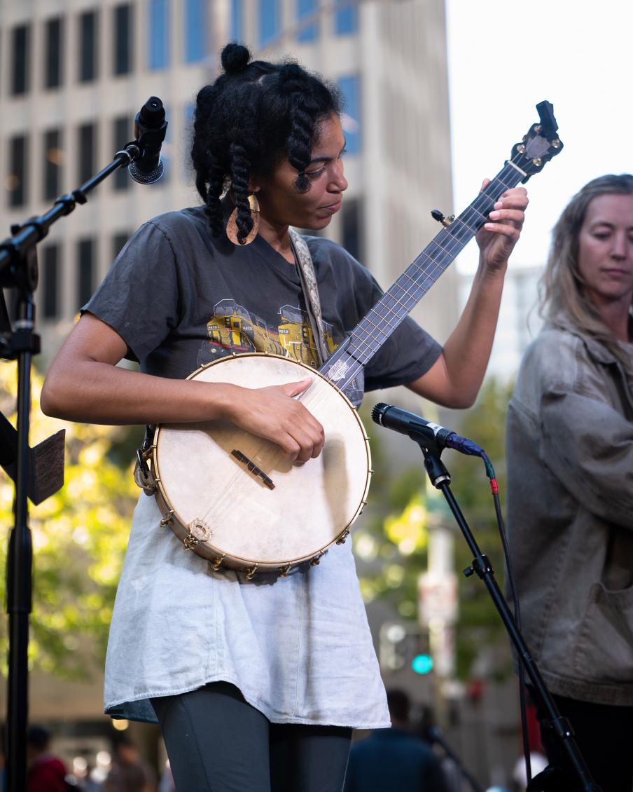 African American woman playing a banjo