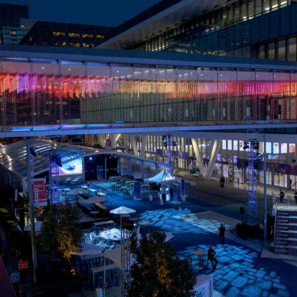 "Point Cloud" by artist Leo Villareal illuminates the glass skybridge with twinkling pink and gold lights.